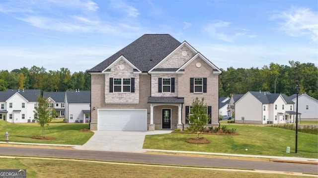 view of front of home with a garage and a front yard