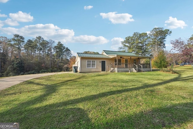 ranch-style house with a front yard and a porch