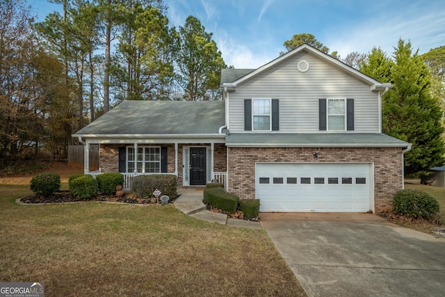 view of front of property with a front yard and a garage