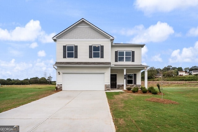 view of front facade with a front yard, a porch, and a garage