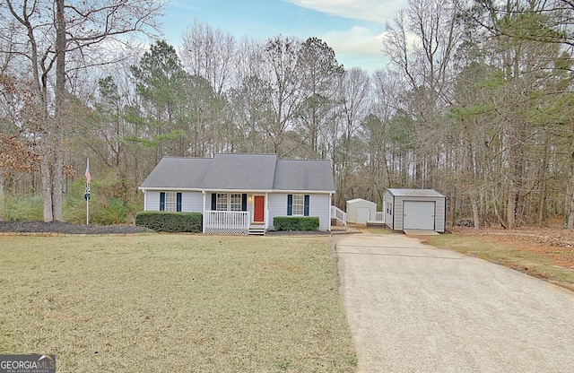 ranch-style home with an outbuilding, a front lawn, a porch, and a garage