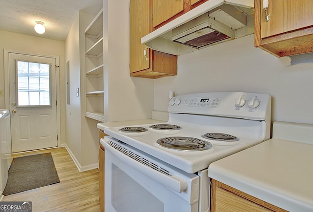 kitchen with light hardwood / wood-style floors, white electric range, and a textured ceiling