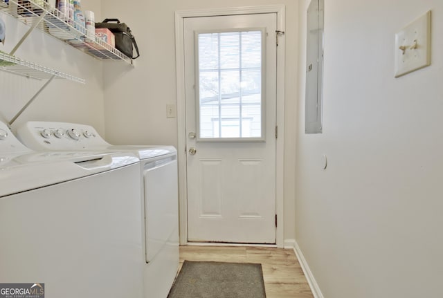 laundry area featuring light hardwood / wood-style floors and independent washer and dryer