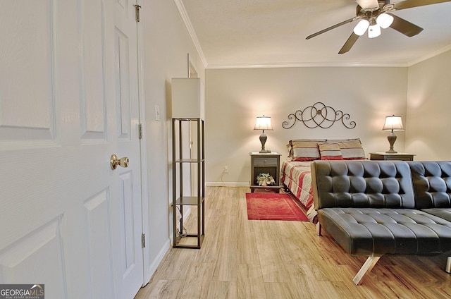 bedroom with ceiling fan, ornamental molding, and hardwood / wood-style flooring