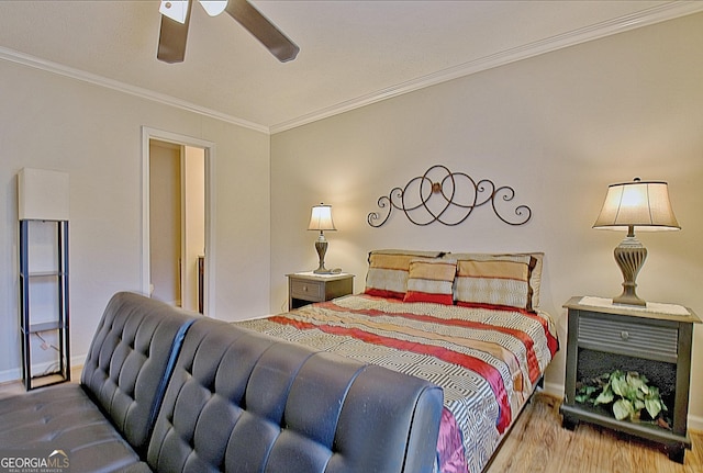 bedroom with ceiling fan, hardwood / wood-style floors, and ornamental molding