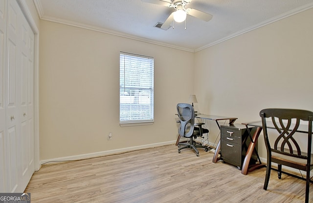 home office featuring a textured ceiling, ceiling fan, crown molding, and light hardwood / wood-style flooring