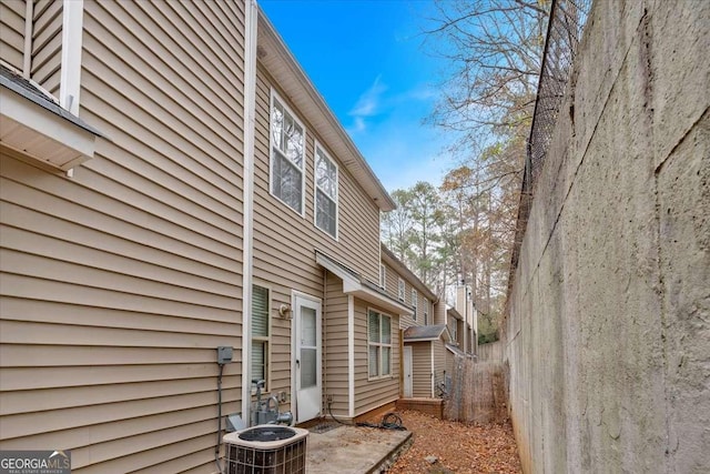 view of side of home with cooling unit