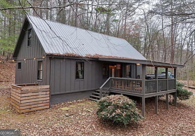 rear view of house featuring a deck