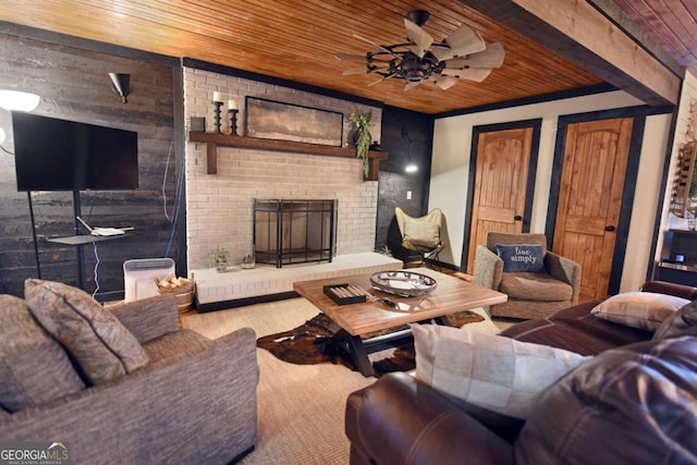 living room with wooden walls, carpet flooring, ceiling fan, a fireplace, and wood ceiling