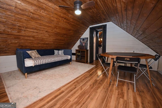 living area with hardwood / wood-style flooring, vaulted ceiling, ceiling fan, and wood ceiling