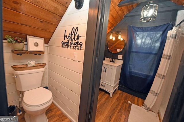 bathroom with wooden walls, wooden ceiling, vaulted ceiling, and hardwood / wood-style flooring