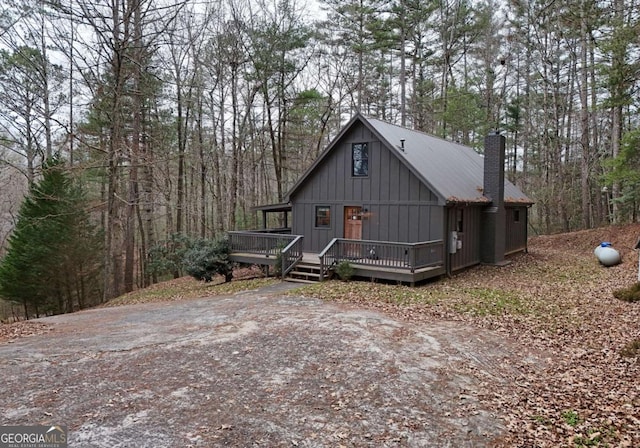 view of front facade with a wooden deck