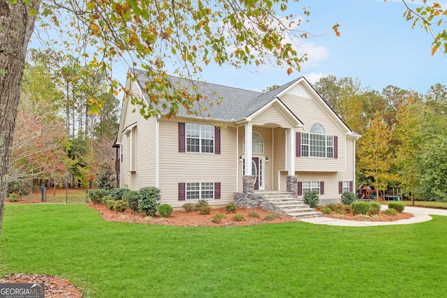 split foyer home with a front lawn