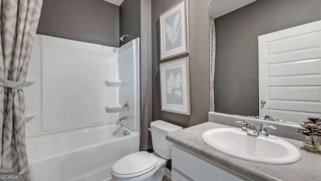 full bathroom with vanity, shower / bath combo, and toilet