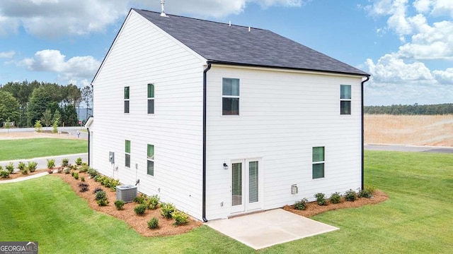 back of property with a yard and cooling unit