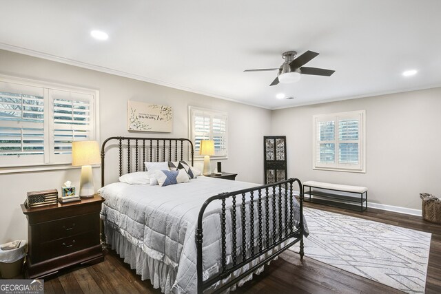 bedroom with ceiling fan, dark hardwood / wood-style floors, and ornamental molding