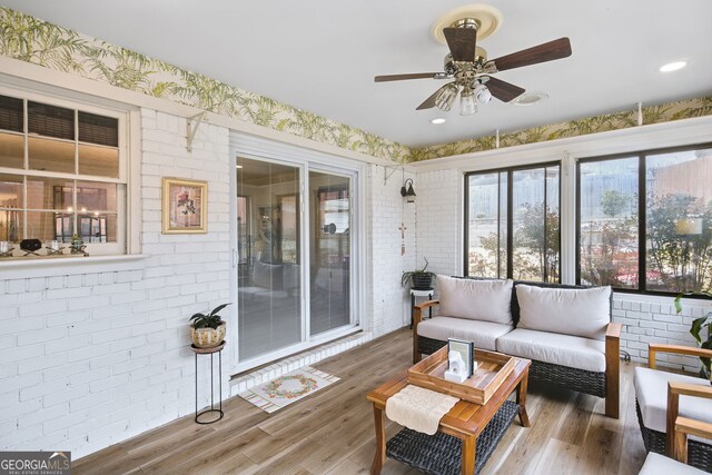 sunroom / solarium with ceiling fan