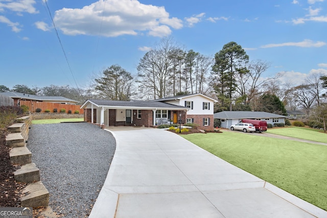 tri-level home featuring a front lawn and covered porch