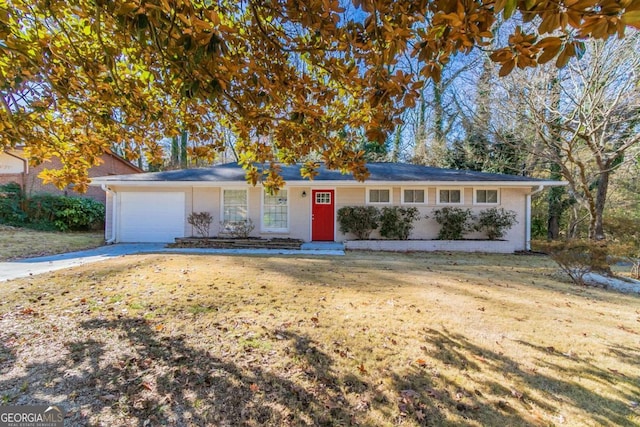 single story home with a garage and a front lawn