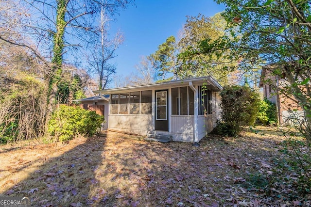 view of front of home with a sunroom