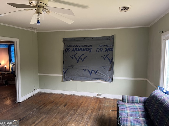 living area featuring dark hardwood / wood-style floors, ceiling fan, and ornamental molding