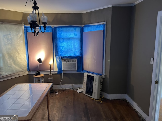 interior space with crown molding, hardwood / wood-style floors, cooling unit, and a notable chandelier