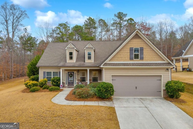 view of front of property featuring a porch and a garage