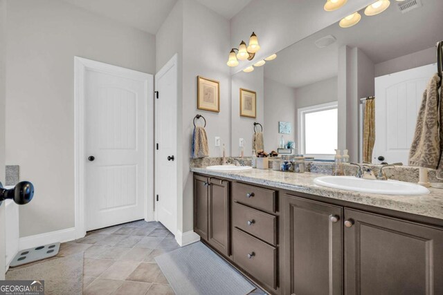 bedroom featuring baseboards, visible vents, a raised ceiling, ornamental molding, and carpet flooring