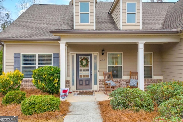 doorway to property with a porch