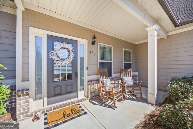 entrance to property with a porch