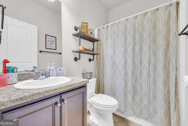 full bathroom featuring toilet, curtained shower, tile patterned flooring, and vanity