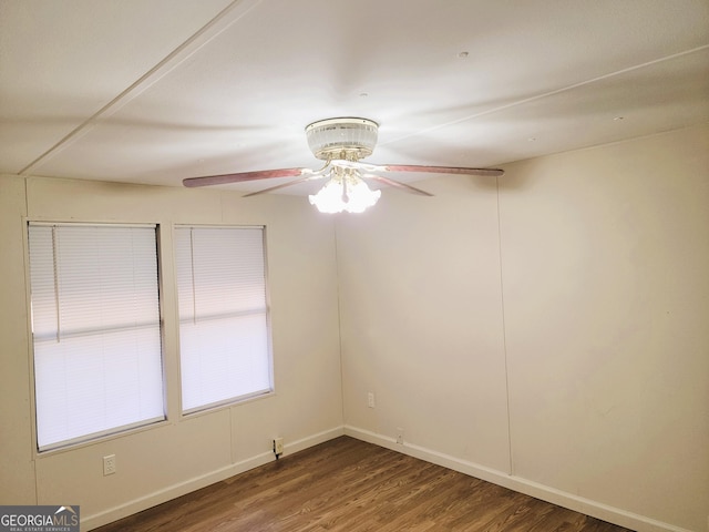 unfurnished room featuring ceiling fan and dark wood-type flooring