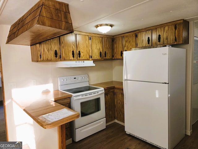 kitchen with dark hardwood / wood-style flooring, white appliances, and range hood