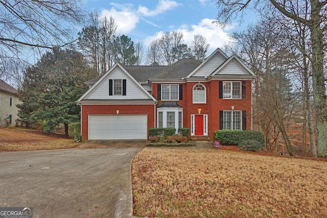 view of front of home featuring a garage and a front lawn