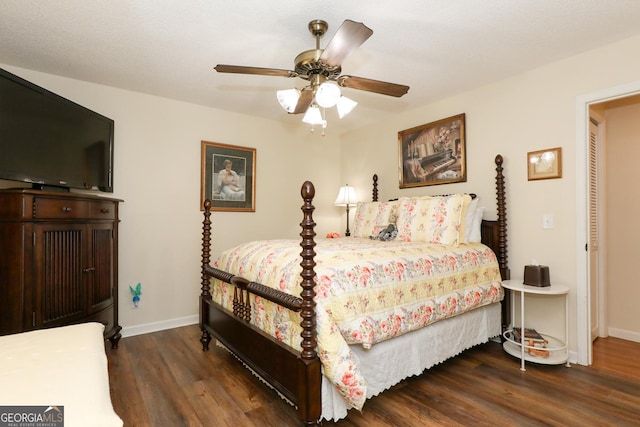 bedroom featuring dark hardwood / wood-style floors and ceiling fan