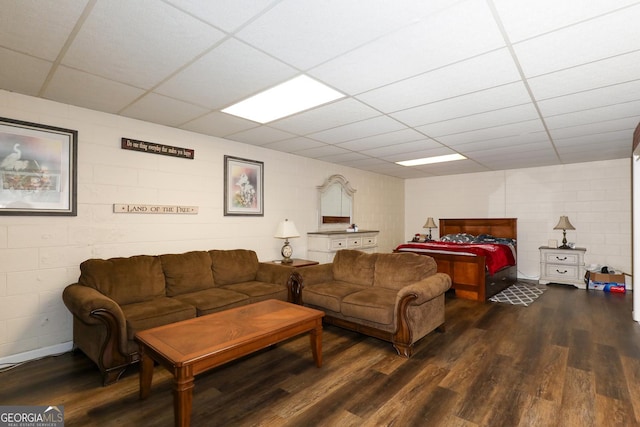 living room with hardwood / wood-style floors and a drop ceiling