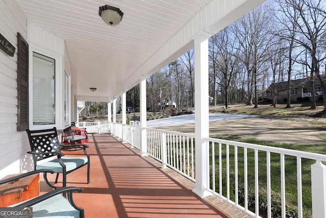 wooden terrace featuring a porch