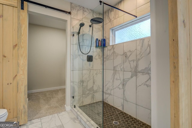 bathroom featuring a shower with shower door