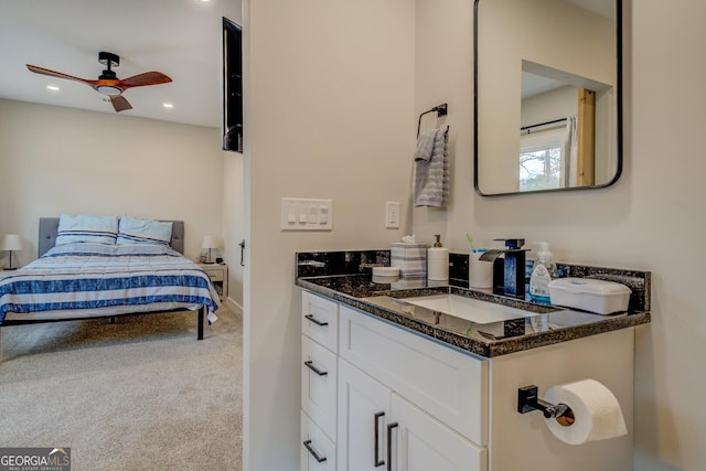 bathroom with ceiling fan and vanity