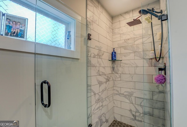 bathroom with a shower with shower door