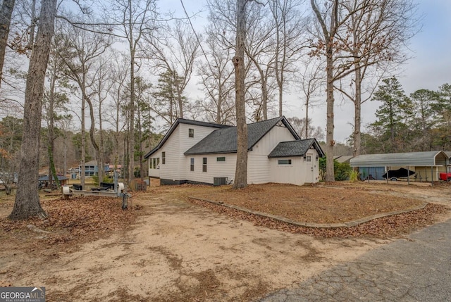 view of property exterior featuring a carport and cooling unit