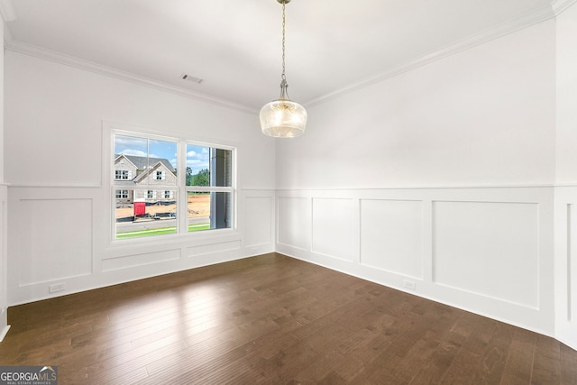 unfurnished dining area featuring dark hardwood / wood-style floors and ornamental molding