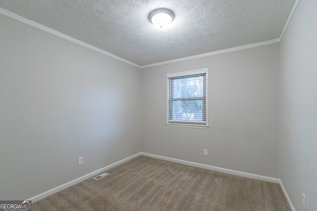 2098 Mallard Crst, Lithonia, GA 30058 - spare room featuring a textured ceiling, carpet floors, and ornamental molding