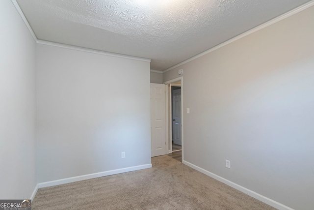 2098 Mallard Crst, Lithonia, GA 30058 - unfurnished room featuring a textured ceiling, crown molding, and light carpet
