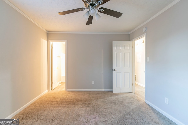 2098 Mallard Crst, Lithonia, GA 30058 - unfurnished bedroom featuring ceiling fan, light colored carpet, ornamental molding, and ensuite bath