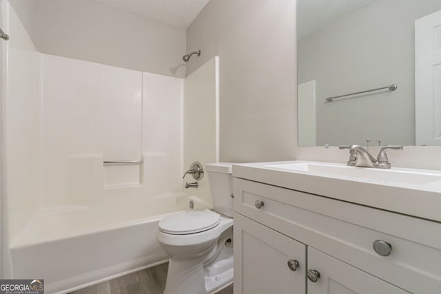 2098 Mallard Crst, Lithonia, GA 30058 - full bathroom with toilet, vanity, shower / tub combination, and hardwood / wood-style floors