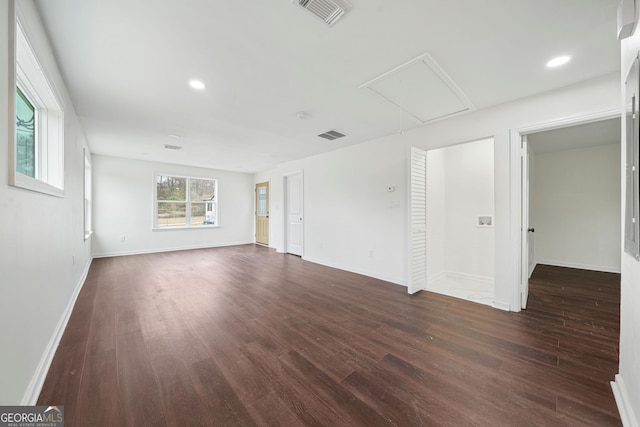 empty room featuring dark wood-type flooring