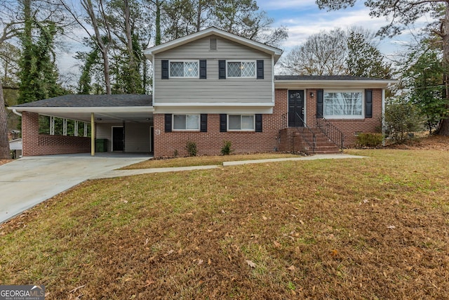 tri-level home featuring a carport and a front lawn