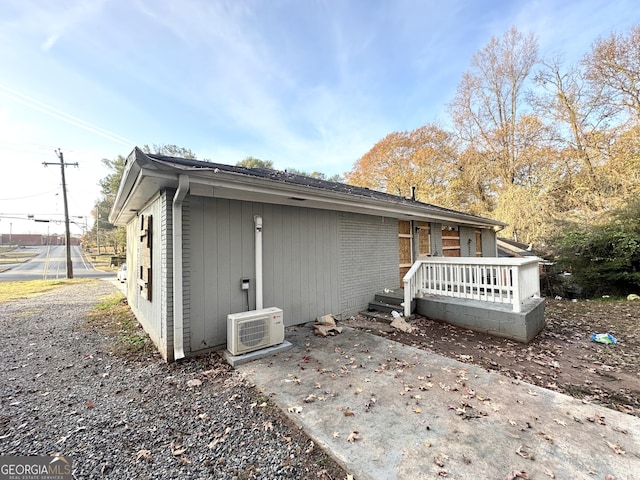 back of house featuring a patio area and ac unit