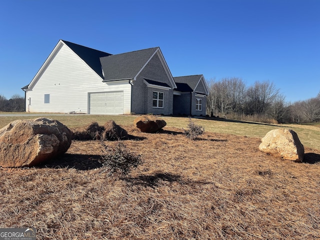 view of home's exterior featuring an attached garage